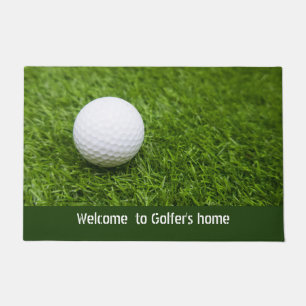 Welcome to golfer's home with golf ball on green doormat