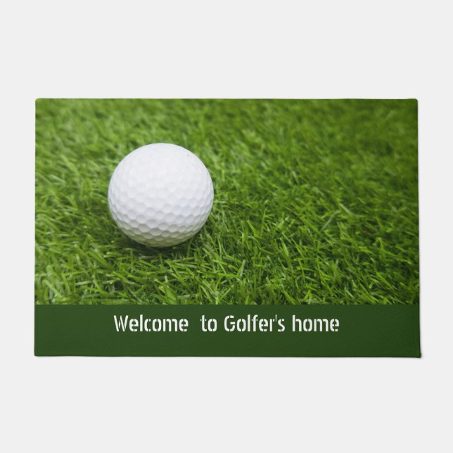Welcome to golfer's home with golf ball on green doormat (Front)