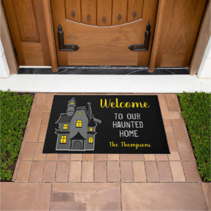 Welcome to our haunted home Halloween Doormat