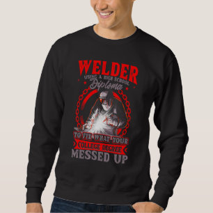Welder Using A High School Diploma To Fix Sweatshirt