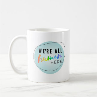 We're All Human Here rainbow logo Coffee Mug