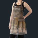 Western Cowboy Boots Rustic Barn Monogram Apron<br><div class="desc">This fun,  rustic apron features two pair of cowboy boots and a log cabin wall with string lights. For the western or horse lover. Wear it in the kitchen or the barn. Created by Simply Farmhouse Press; photo by Melanie Mauer on Unsplash.</div>