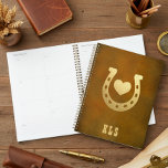 Western Theme Horseshoe Brown & Gold Monogram Planner<br><div class="desc">This unique planner features a simple brown, aged leather-look background with a faux gold horseshoe and heart. A monogram of initials completes the design. Perfect for the western, cowboy, or horse lover in your family. Created by Simply Farmhouse Press.</div>