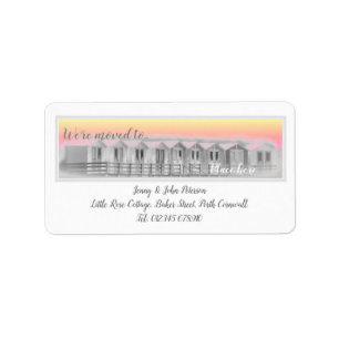 We've moved labels with beach huts at sunset