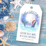 Whale Santa Seas and Greetings Nautical Christmas  Gift Tags<br><div class="desc">Add some nautical fun to your presents with these cute Christmas gift tags featuring a watercolor whale wearing a Santa hat swimming in the sea under a magical moon and stars with string lights decorating its tail. The "Seas & Greetings" and "Wishing you a whale of a good Christmas" greetings,...</div>