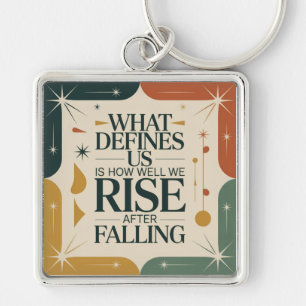 What Defines Us Is How Well We Rise After Falling Keychain