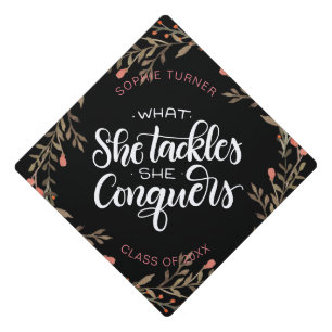 What she tackles she conquers -Brown - Graduation Cap Topper