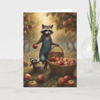 Whimsical Raccoon picking apples in the orchard Card