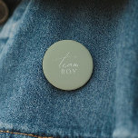 Whimsical Sage Green Gender Reveal Team Boy 2 Inch Round Button<br><div class="desc">Introducing our whimsical sage green gender reveal team boy button, perfect for your simple modern boho celebration any season of the year! This button has a boho-chic, gender-neutral vibe with elegant calligraphy and a delicate minimalist design, making it ideal for both girls and boys. Plus, it's editable, so you can...</div>