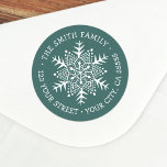 Whimsical snowflake pine green return address classic round sticker<br><div class="desc">Winter holiday return address rubber label featuring a white,  whimsical,  folk art style snowflake and your name and address on a pine green background. All colours are customizable.</div>