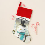 Whimsical Snowman in Winter Christmas Scene Christmas Stocking<br><div class="desc">Christmas stocking with a cute drawing featuring a snowman wearing a cool top hat and scarf. The background has a line of whimsical snow-covered pine trees</div>