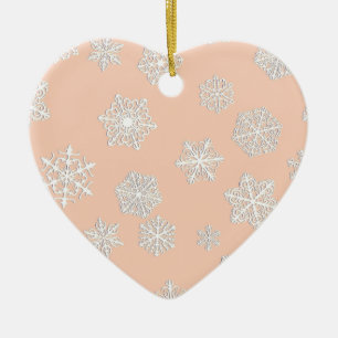 White 3-d snowflakes on a peach background ceramic ornament