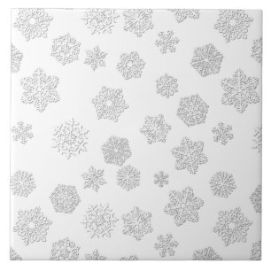 White 3-d snowflakes on a white background tile