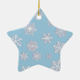 White 3-d snowflakes on an ice blue background ceramic ornament