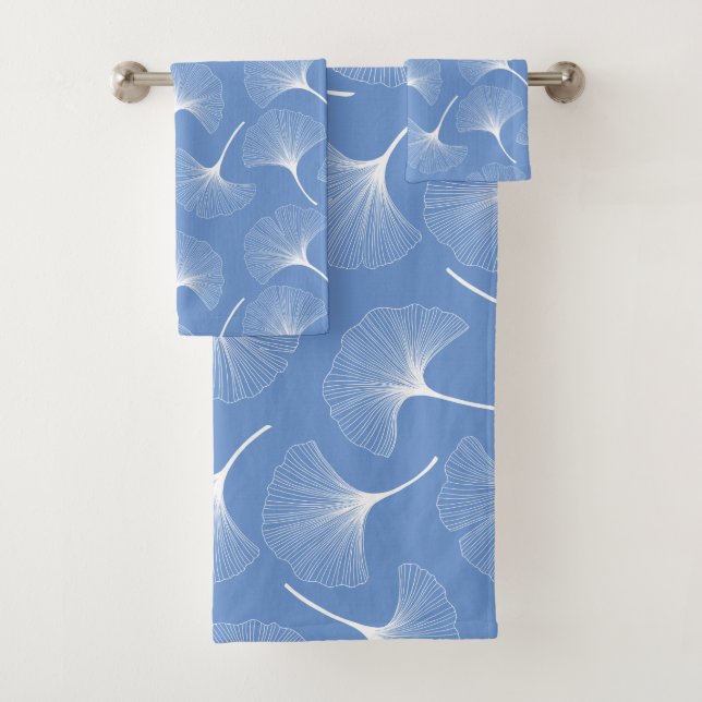 White abstract leaves on blue background bath towel set (Insitu)