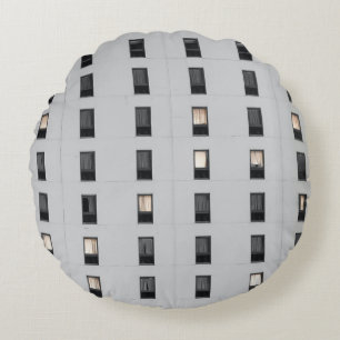 White and black concrete building round pillow