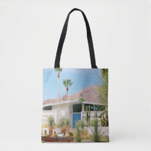 WHITE AND BLUE CONCRETE BUILDING NEAR GREEN TREES TOTE BAG