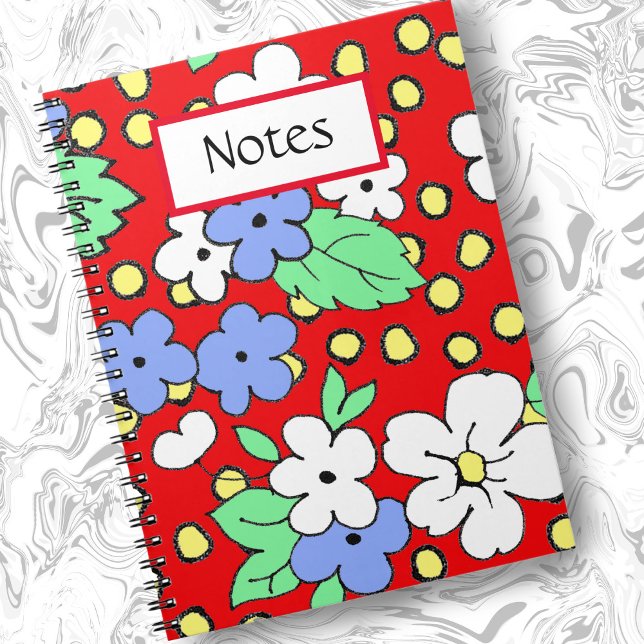 White and blue flowers on red spiral notebook (Creator Uploaded)