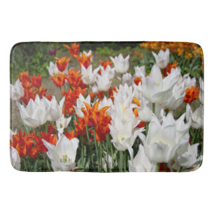 White and ginger tulips in the garden bath mat