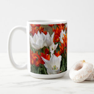 White and ginger tulips in the garden      coffee mug