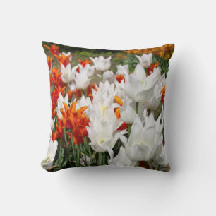 White and ginger tulips in the garden  throw pillow