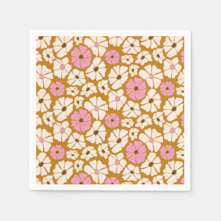 White and pink floral pattern on caramel brown napkin