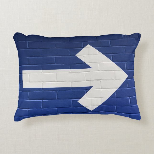 White arrow painted on brick wall accent pillow (Front)