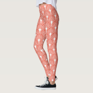 White art deco pattern over orange background leggings
