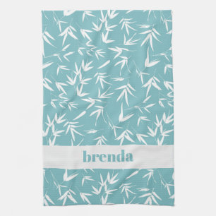 White bamboo leaves on teal background kitchen towel