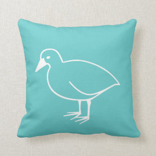 white bird on teal blue pillow