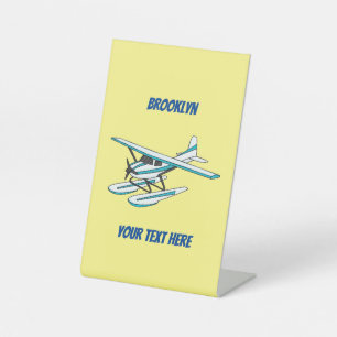 White blue seaplane illustration  pedestal sign
