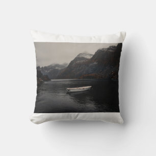 WHITE BOAT ON BODY OF WATER NEAR MOUNTAINS THROW PILLOW