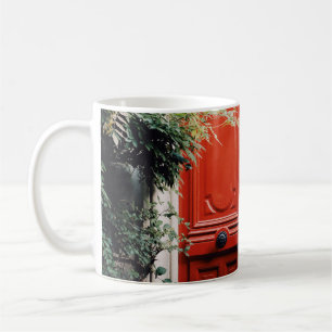 WHITE BUILDING SHOWING CLOSED RED WOODEN DOOR COFFEE MUG
