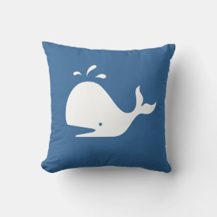 white CARTOON whale on medium blue pillow