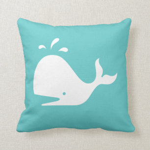 white CARTOON whale on teal blue pillow