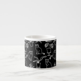 White cats on black espresso cup