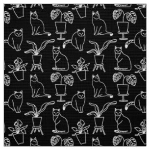 White cats on black fabric