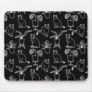 White cats on black mouse pad