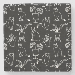 White cats on black stone coaster