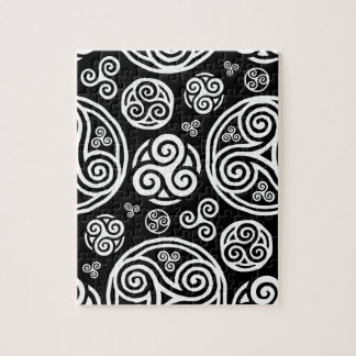 White celtic triskels on black jigsaw puzzle