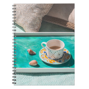 White ceramic mug on white serving tray notebook