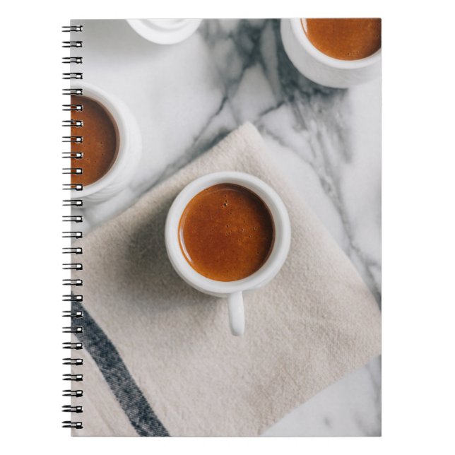 WHITE CERAMIC TEACUP FILLED WITH RED LIQUID NOTEBOOK (Front)
