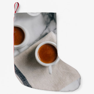 WHITE CERAMIC TEACUP FILLED WITH RED LIQUID SMALL CHRISTMAS STOCKING