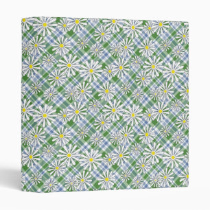 White chamomile flowers on a green blue chequered binder