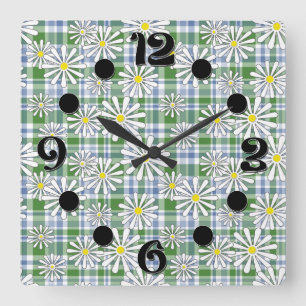 White chamomile flowers on a green blue chequered  square wall clock
