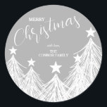 White Christmas Trees Classic Round Sticker<br><div class="desc">Create stickers for any use! Party favours,  invitation envelopes,  Christmas holiday homemade goods,  cookies,  candy,  treats and more featuring white Christmas trees on silver grey and your names and Merry Christmas in chic lettering.</div>