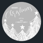 White Christmas Trees Classic Round Sticker<br><div class="desc">Create stickers for any use! Party favours,  invitation envelopes,  Christmas holiday homemade goods,  cookies,  candy,  treats and more featuring white Christmas trees on silver grey and your names and Merry Christmas in chic lettering.</div>