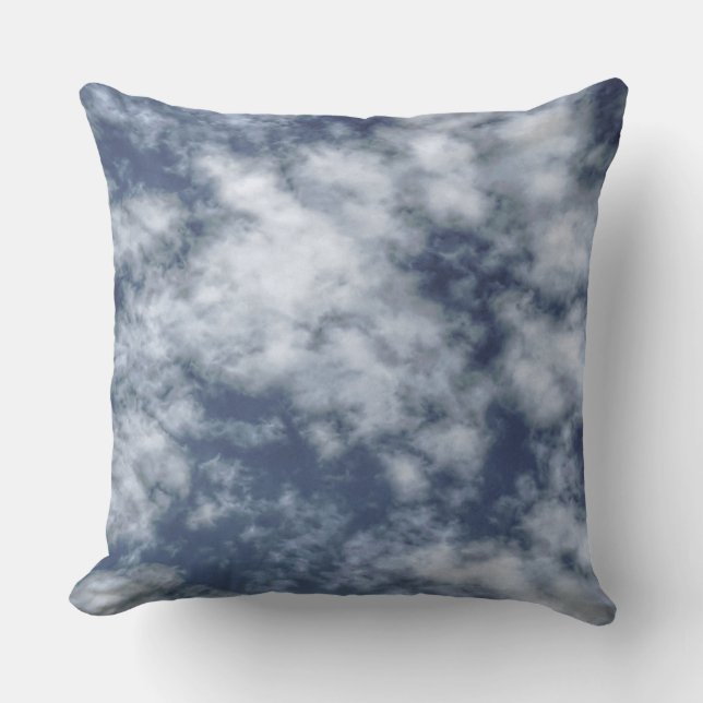 White clouds against blue sky on throw pillow (Front)