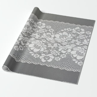 White colour straight strip of lace fabric on grey wrapping paper