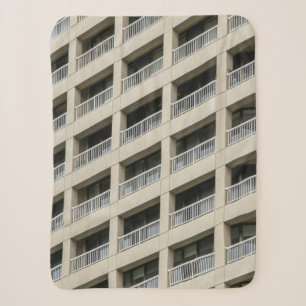 White concrete building during daytime sherpa blanket